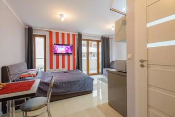 Фото номера Номер-студио с диваном-кроватью Апартаменты Apartamenty NCNK Baltic Park w Stegnie г. Стегна 2