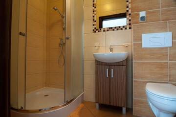 Фото номера Четырехместный номер Апартаменты Apartamenty Gajówka- sauna jacuzzi, rowery г. Стегна 6