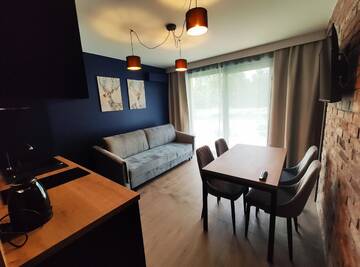 Фото номера Апартаменты с террасой Апартаменты Apartamenty Gajówka- sauna jacuzzi, rowery г. Стегна 3