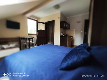 Фото номера Четырехместный номер Апартаменты Apartamenty Gajówka- sauna jacuzzi, rowery г. Стегна 4