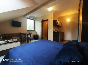 Фото номера Четырехместный номер Апартаменты Apartamenty Gajówka- sauna jacuzzi, rowery г. Стегна 3