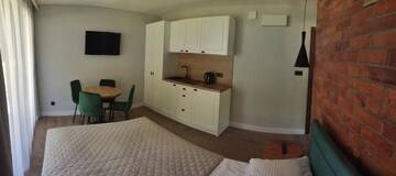 Фото номера Номер-студио с террасой Апартаменты Apartamenty Gajówka- sauna jacuzzi, rowery г. Стегна 2
