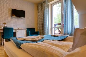 Фото номера Двухместный номер с 2 отдельными кроватями Отель Hotel Krakus г. Стегна 4