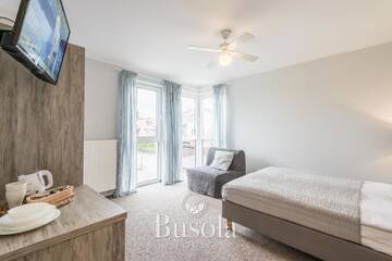 Фото номера Номер Делюкс (для 2 взрослых и 1 ребенка) Проживание в семье Busola House г. Стегна 3